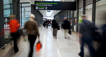 passengers walking through Dublin Airport