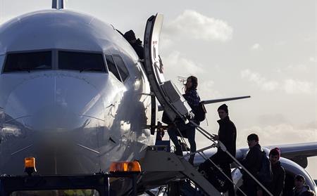 passengers boarding plane